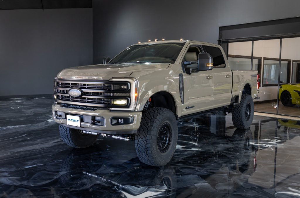 Custom Ford Super Duty truck featuring lifted suspension, off-road wheels and tires, and aftermarket accessories installed by Apex Custom Innovations