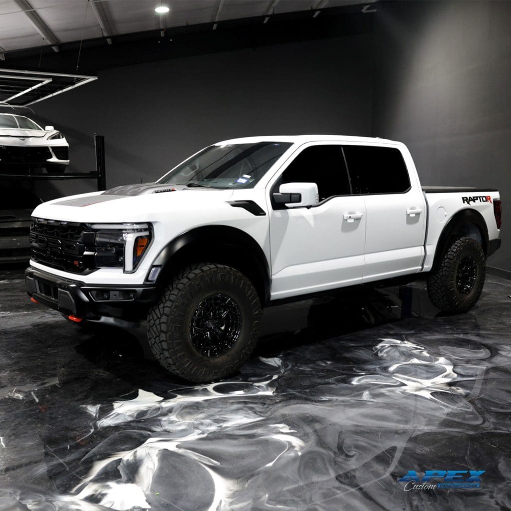 2025 Ford F-150 Raptor R with Vossen HFX1 wheels and Nitto Ridge Grappler tires photographed in the Apex Custom Innovations studio in Dallas Texas