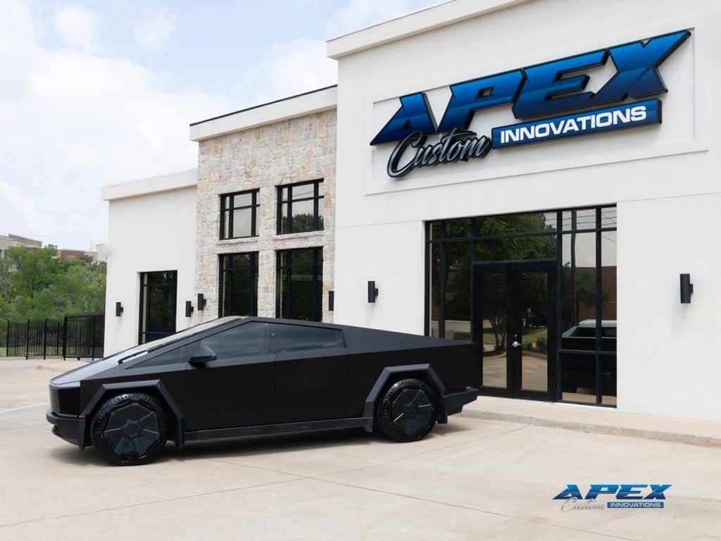 Side profile of 2024 Tesla Cybertruck with satin black wrap outside Apex Custom Innovations